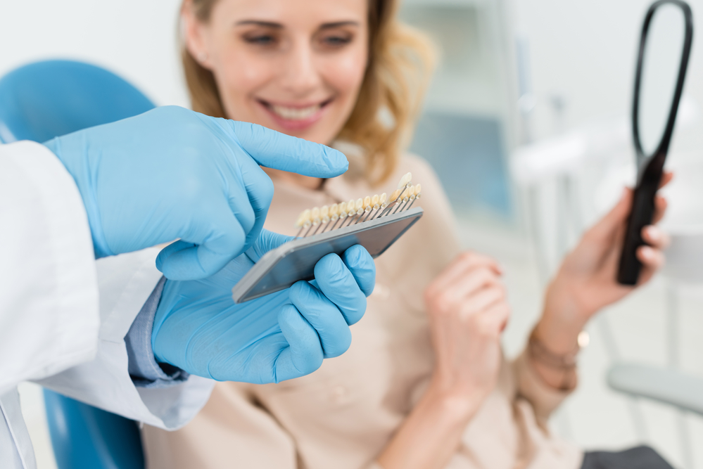 dental patient choosing dental implant crown shade